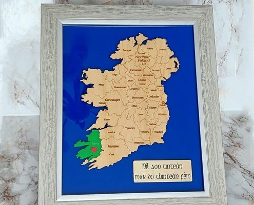 Ireland map with selected county highlighted in green acrylic against blue ocean background, Irish Gaelic text in A4 wooden frame