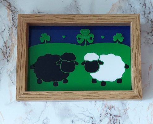 Irish sheep and lambs framed acrylic art with blue background and green shamrocks in 16x12cm wooden frame